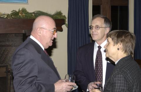 Robert Bennett Speaks with John Youson and Unidentified Attendee, Advancement Christmas Party, Miller Lash House