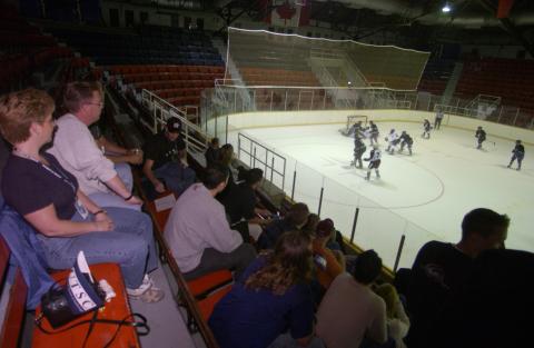 General View of Spectators Watching Hockey Game, Homecoming Event (Varsity Arena, St. George Campus?)