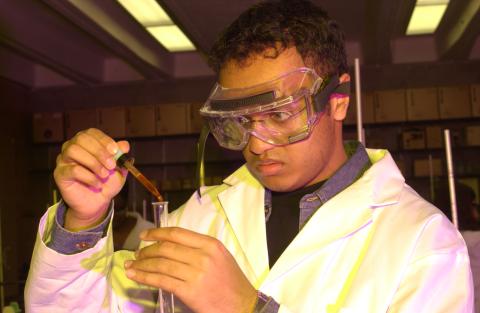 Student works with Chemistry Equipment in Lab