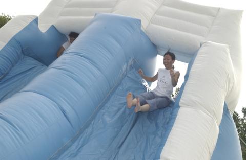Student Slides on Inflatable Obstacle Course, Orientation, 2001
