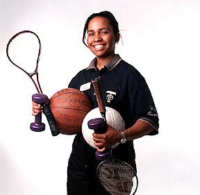 Student in Branded Shirt, Holding a Variety of Sports Equipment, Studio Promotional Image