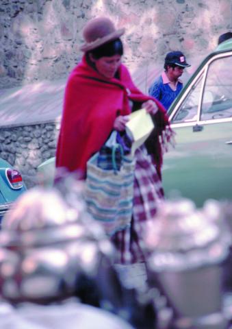 Woman Standing next to Car, International Setting