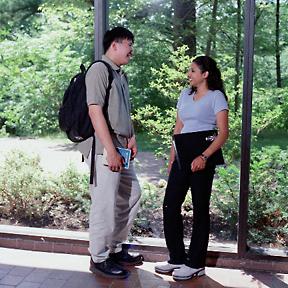 Two Students in H-Wing Corridor, overlooking H-Wing Patio, Promotional Image