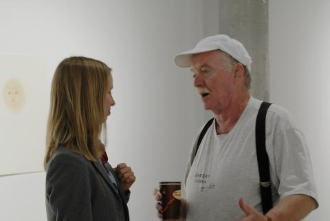 Artist, Ron Giii Talks with Person at Ron Giii Exhibition, Doris McCarthy Gallery