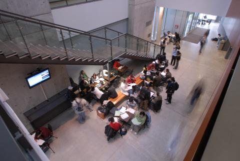 View of Students in the Management Building Atrium, Image Taken from Upper Level of Building