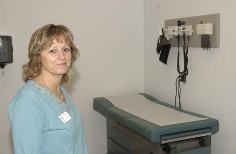 Woman in Medical Exam Room, Health and Wellness Services