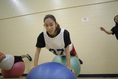 Student with Exercise Ball for Fitness Challenge