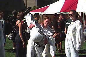 Students Wearing White Coveralls for Orientation Event, Outdoors