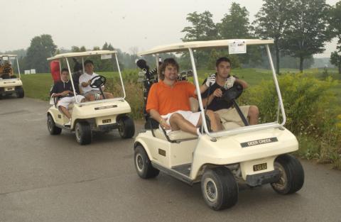 Participants Driving in Golf Carts, Management Alumni Association Golf Tournament, 2002, Deer Creek Golf Club
