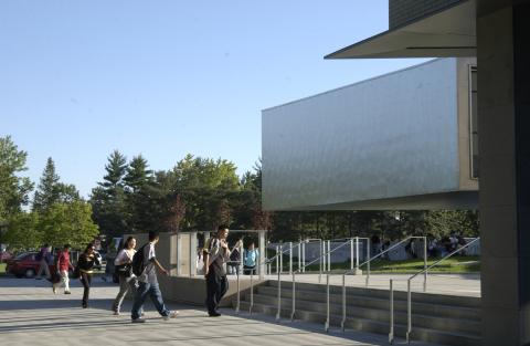 Students Walking towards Exterior Stairs at Student Centre Entrance