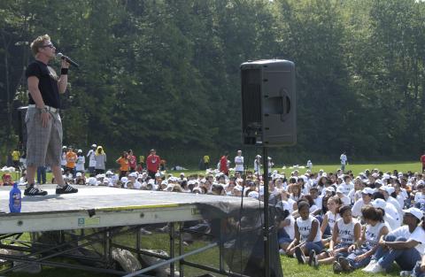 Speaker, On Stage, Addressing Group of Students Seated on Lawn, Orientation, 2005