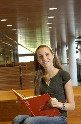 Student Reads Book by Second Floor Gallery over Library Entrance, UTSC Library, Academic Resource Centre (ARC)