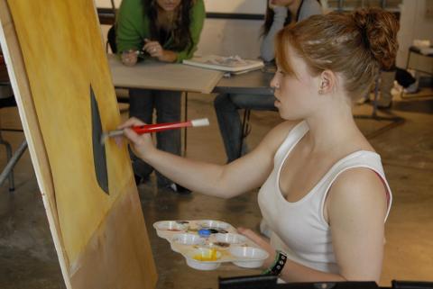Student Paints at Easel in Studio