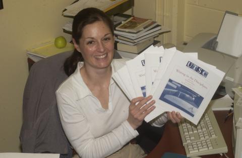 Kristen Guest, with Copies of the Guide, Writing in the Disciplines