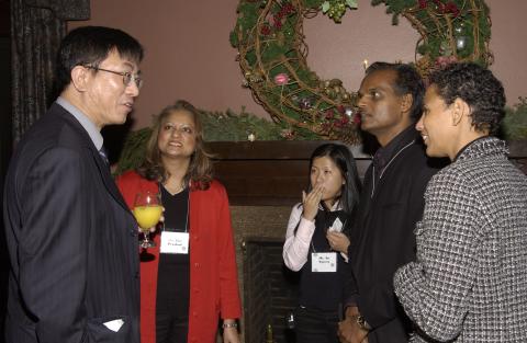 Kwong-loi Shun Speaks with Zita Prashad, An Nguyen and other Party Guests, Advancement Christmas Party, Miller Lash House