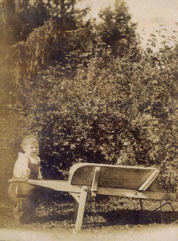 Historical Photograph, Child with Wheelbarrow, Miller Lash House Property