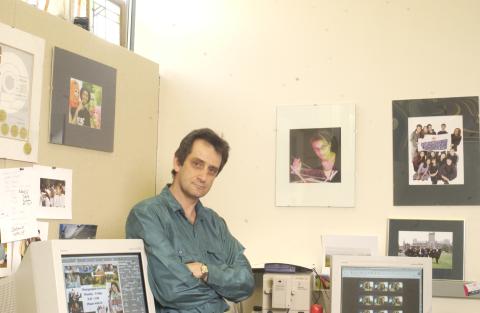 Ken Jones, in Office with Computers and Photographs