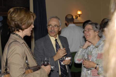 Two Unidentified Event Attendees Talking with Michael Krashinsky, Faculty Orientation Event, Miller Lash House
