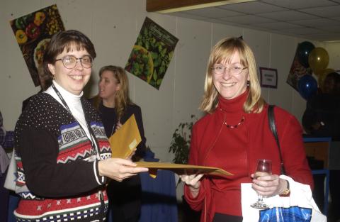 Janice Crichton-Patterson Gives Envelope to Event Participant, "Teaching & Learning for Diversity at UTSC" Conference