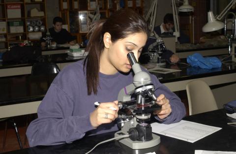 Woman Using Microscope