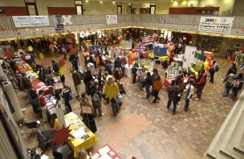 Overview of Volunteer Fair, Showing Students, Presenters and Tables. Image Taken from Second Floor Gallery, the Meeting Place