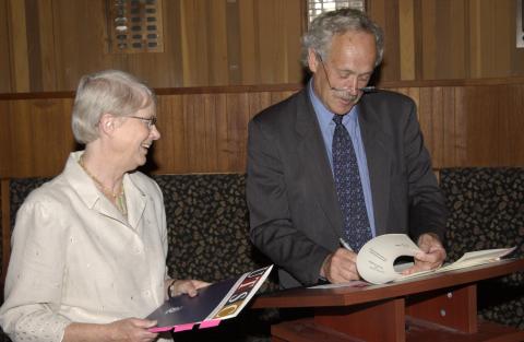 Joan Foley stands next to Richard Johnston Signing Document, UTSC - Centennial Joint Programs, Signing Event, Old Council Chambers