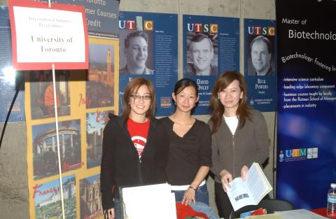 Students with Promotional Material, University of Toronto International Summer Programs Table, Graduate & Professional Schools Fair, the Meeting Place