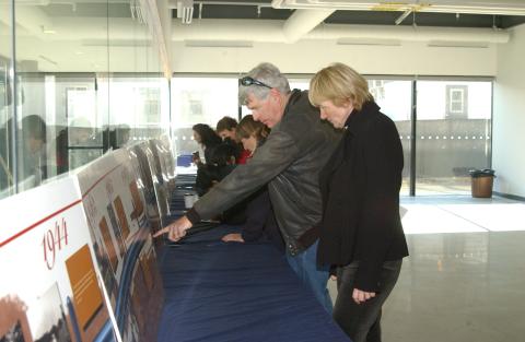 Attendees Look at Timeline Display, UTSC Fortieth Anniversary Event