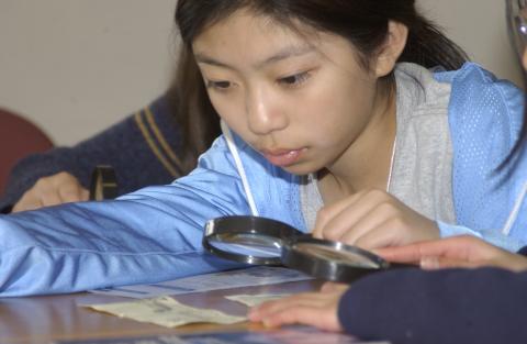 Child Examining Currency, Activity, Bring our Children to Work Day