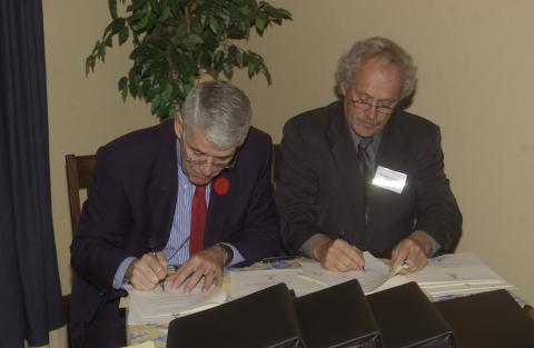 Robert Birgeneau and Richard Johnston Sign Documents, Celebration of the Signing of the Agreement for the Joint Programs (Centennial College and UTSC) in Journalism and Paramedicine, Miller Lash House