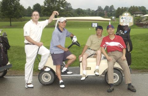 Four Players Pose by Golf Cart, Management Alumni Association Golf Tournament, 2002, Deer Creek Golf Club