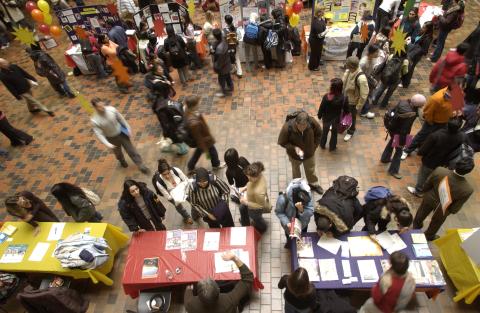Overview of Volunteer Fair, Showing Students, Presenters and Tables. Image Taken from Second Floor Gallery, the Meeting Place