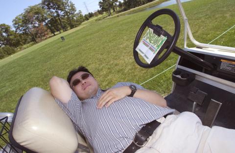 Golf Player Rests in Front Seat of Golf Cart, UTSC Management Alumni Association Golf Tournament, 2001, Deer Creek Golf Club
