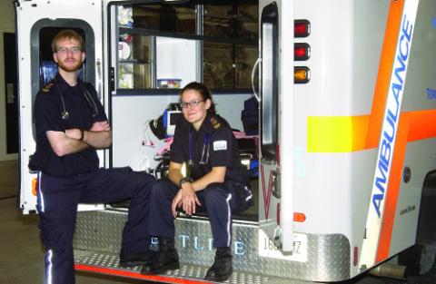 Students in Paramedicine Program Pose with Ambulance