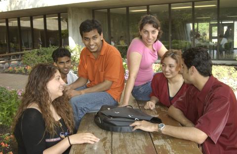 Group of Students at Picnic Table, H-Wing Patio