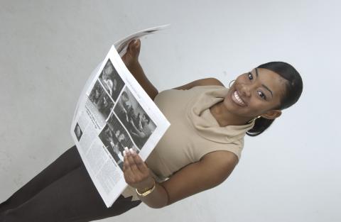 Siobhan Dixon, Student with Newspaper, Promotional Image for Journalism Program