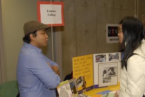 Presenter Talks to Student at Frontier College Table, Expand Your Horizons: Volunteer & Internship Fair, the Meeting Place