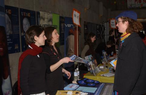 Student Speaks with Presenter at SWAP Table, Volunteer Fair, the Meeting Place