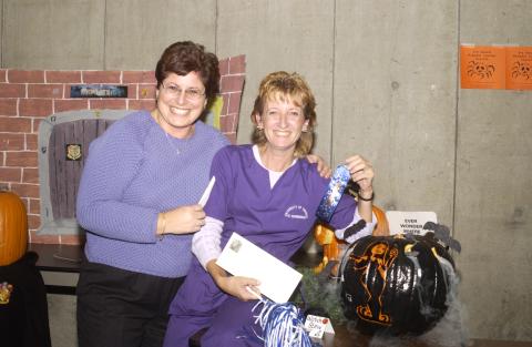 Judge and Team Member from Health Studies with First Place Winner, Pumpkin Carving Contest, the Meeting Place