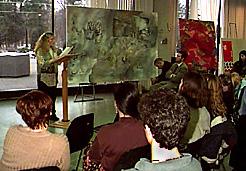 Woman Reading, Standing Beside Paintings, Artparty Event