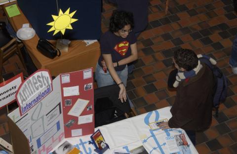 Aerial View, Presenter and Student, Amnesty International Table, Volunteer Fair, the Meeting Place