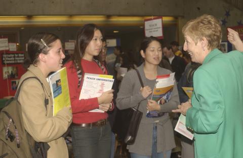 Students Speak with Representative, University of Wollongong, Graduate and Professional Schools Fair, the Meeting Place