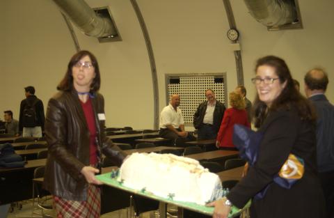 Two Event Attendees Move the Celebration Cake, Opening Event for UTSC Pavilion (Temporary Lecture Space)