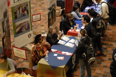 View from Second Floor Gallery, Student Speaks with Presenter, Queen's University, Faculty of Law, Graduate and Professional Schools Fair, 2006, the Meeting Place