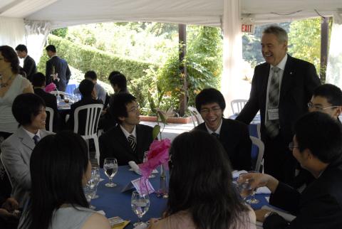 Faculty Member Speaks with Students at Table, Green Path Program Graduation Event, Marquee Tent, Miller Lash House Gardens
