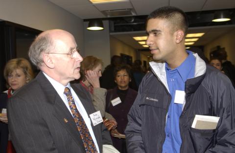 John Kennedy speaks with Student in Hallway, Honours Night Ceremony, Academic Resource Centre (ARC)