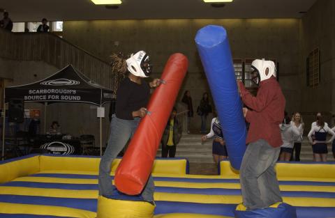 Two Students Play Inflatable Joust Arena Game, Spirit Event, the Meeting Place