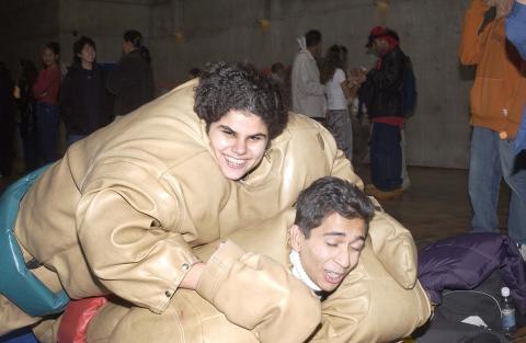 Two Students Wrestle in Inflatable Sumo Wrestling Costumes, Spirit Event, the Meeting Place