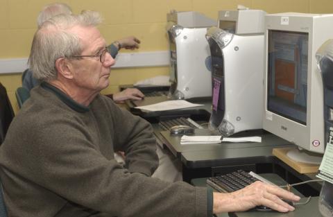 Senior Working at Computer
