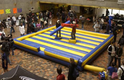 Two Students Play Inflatable Joust Arena Game, Image Taken from Second Floor Gallerey, Spirit Event, the Meeting Place